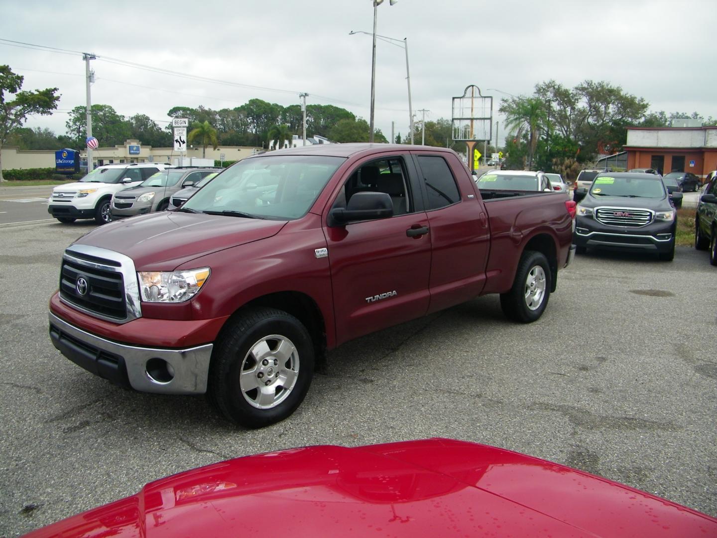 2010 Maroon /Gray Toyota Tundra SR5 Double Cab 4.6L 2WD (5TFRM5F14AX) with an 4.6L V8 DOHC 32V engine, 5-Speed Automatic Overdrive transmission, located at 4000 Bee Ridge Road, Sarasota, FL, 34233, (941) 926-0300, 27.298664, -82.489151 - Photo#0